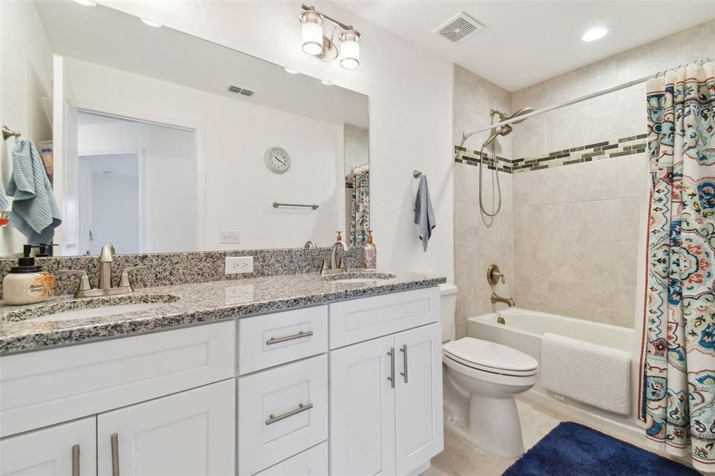 2nd Bathroom with dual vanity and tub/shower combo