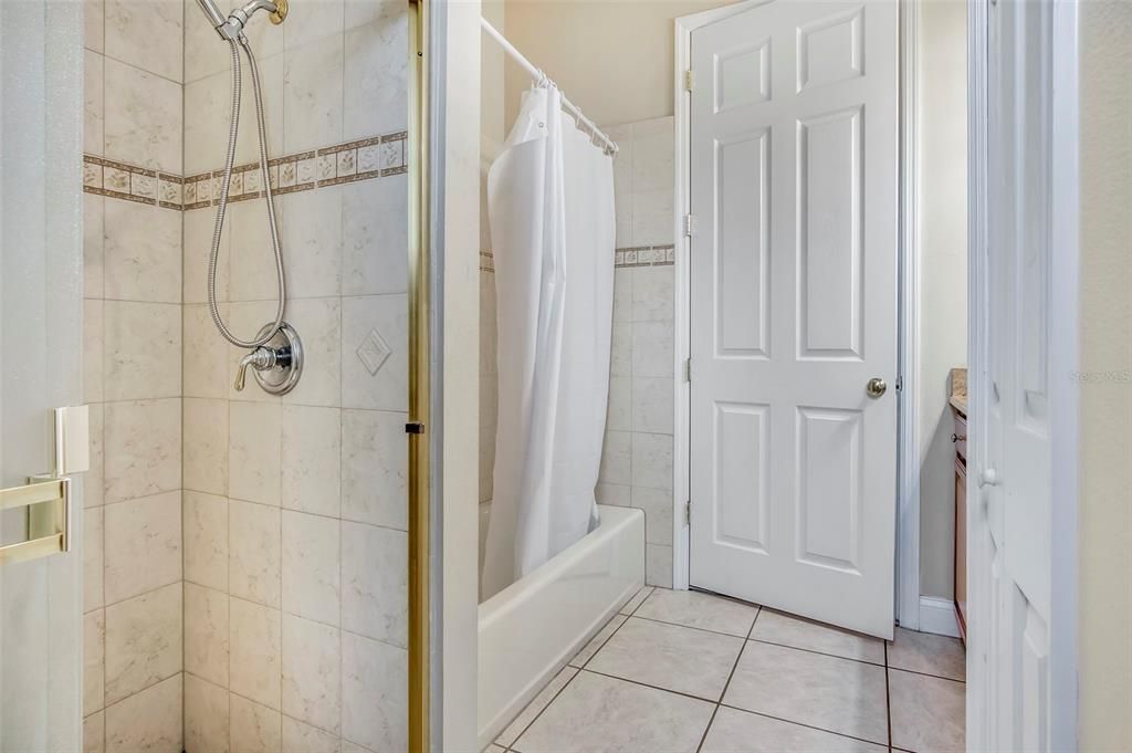 Full bathroom has both a shower and tub