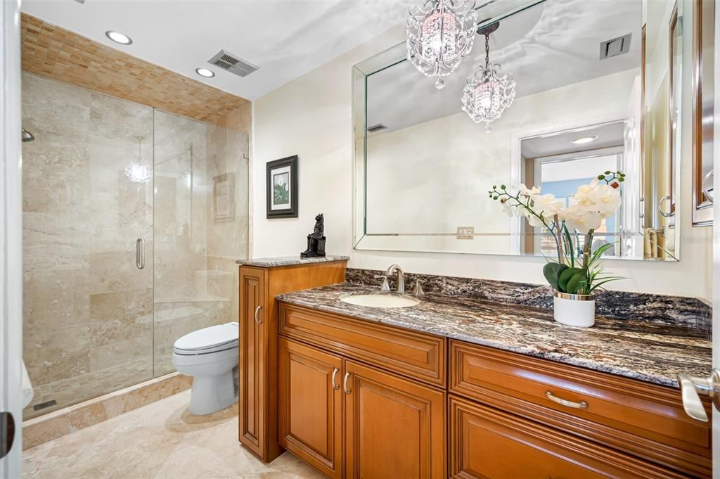 2nd Bath with custom cabinetry, oversized walk in shower, granite