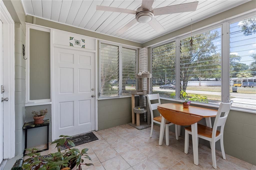 Front enclosed porch, has a window a/c unit for working out or just sipping coffee on humid days.