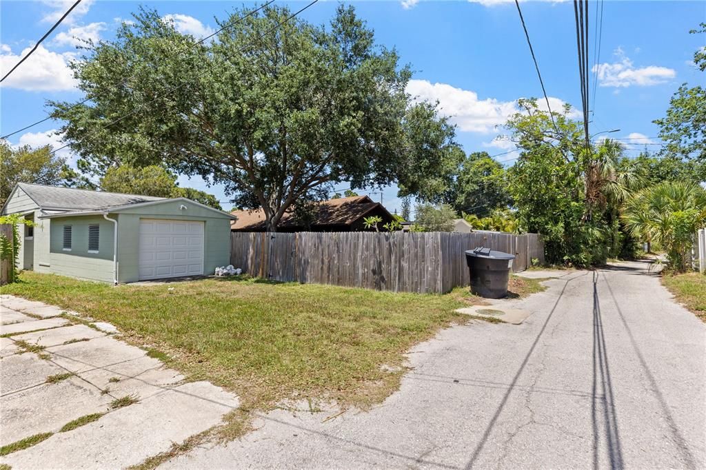 Paved rear alley to park extra vehicles, plus the garage!