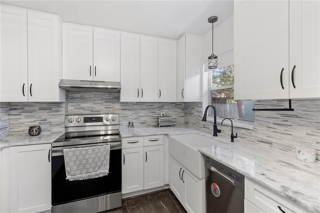 Kitchen updated in 2020 with Wood cabinets and Marble counter tops