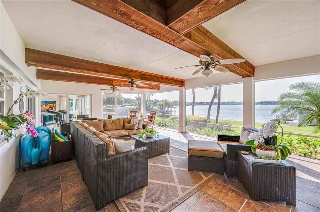 Large downstairs screened porch has room for outdoor entertaining