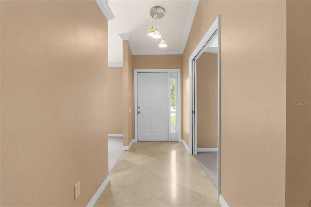 Entry way. In picture formal dining room is on the left and 4th bedroom is on the right