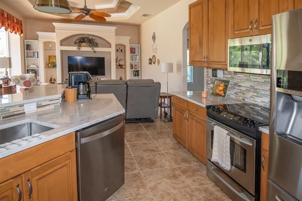 Beautiful kitchen with ample solid wood cabinets and new granite countertops.