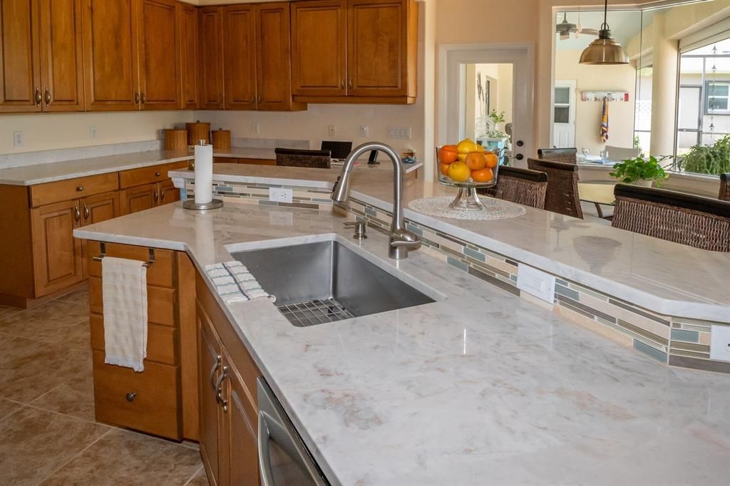 Perfect for entertaining.  Access door to the lanai, and eating area in front of the aquarium glass window.