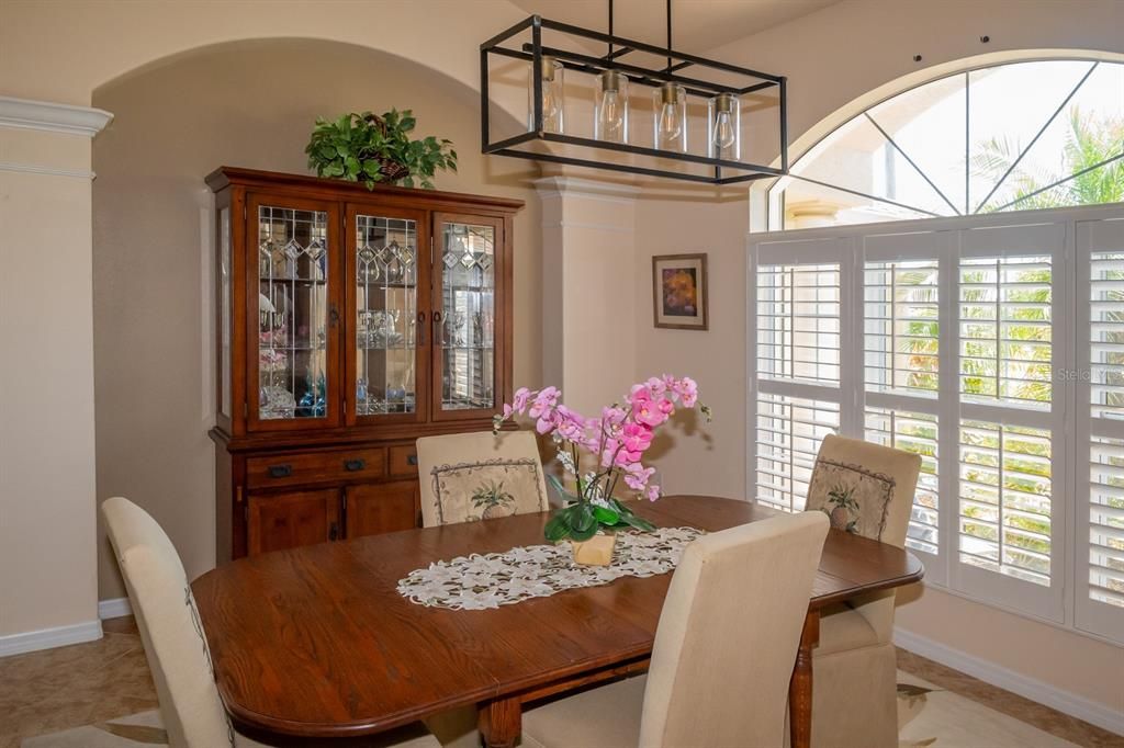 Dining room with plantation shutters.