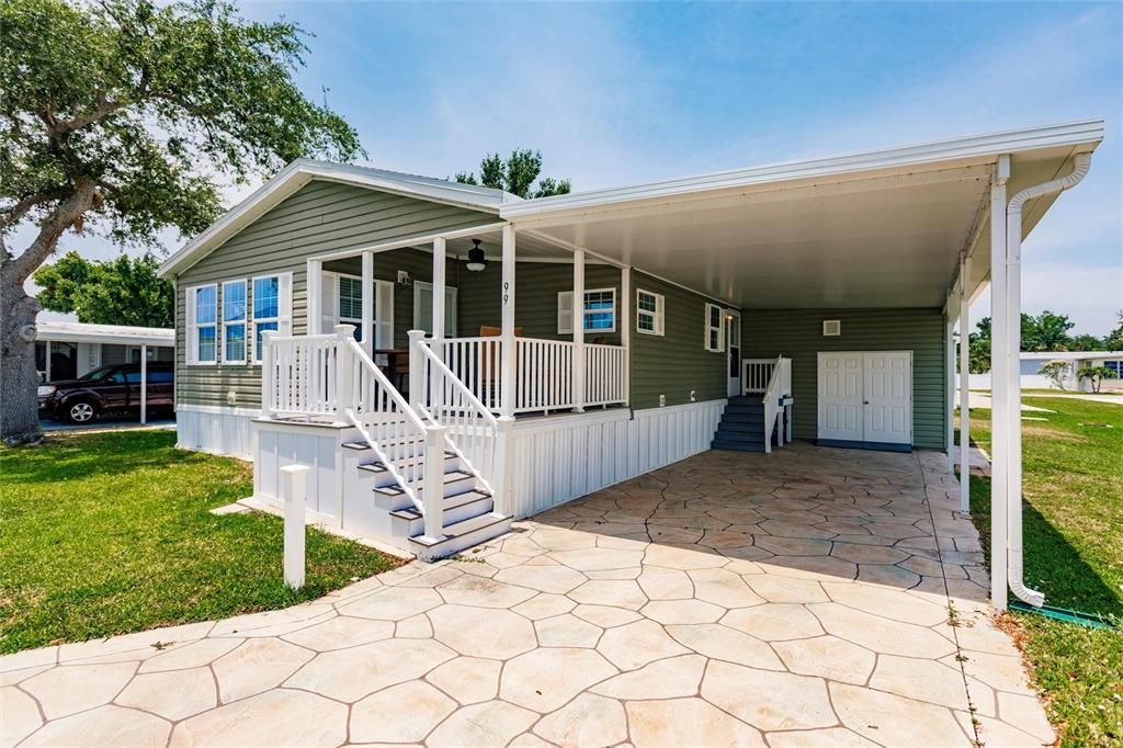 Covered carport, stamped concrete driveway