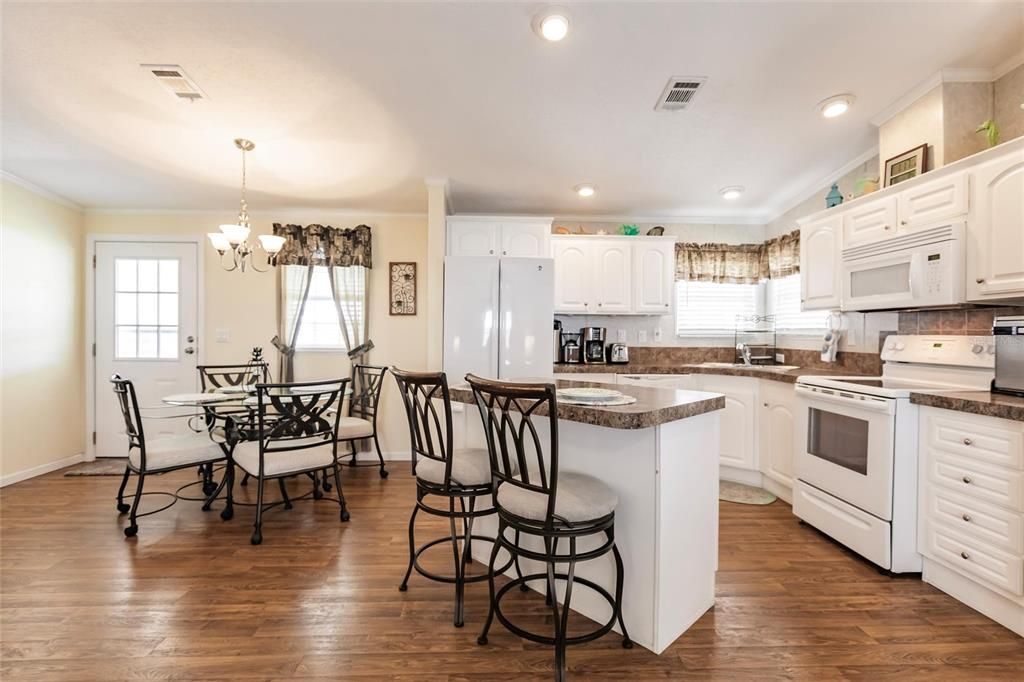 Open kitchen with dining area.