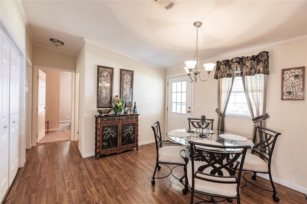 Dining room hallway leading to bedrooms and front door from carport