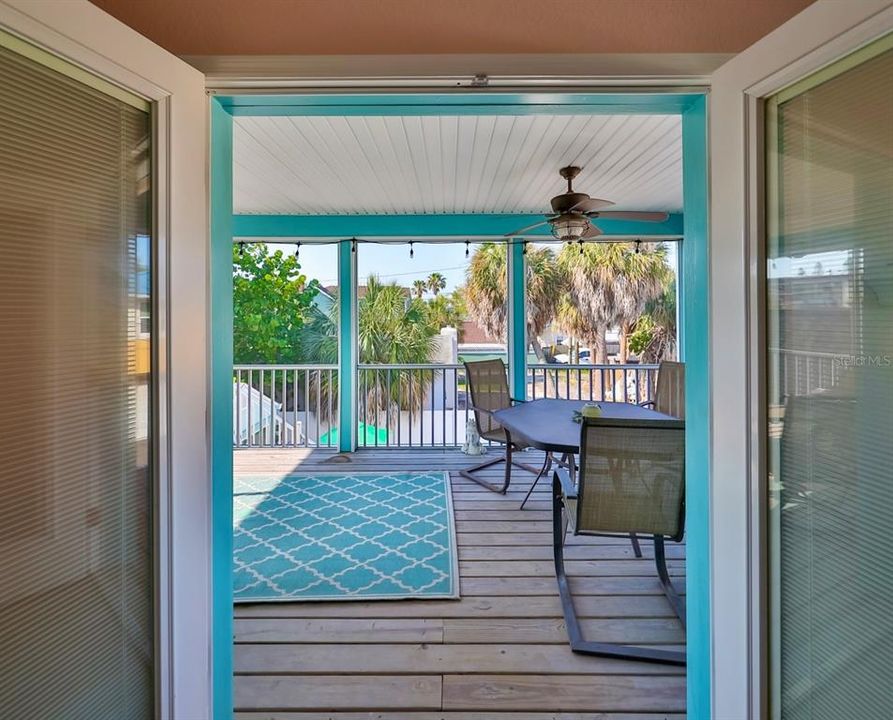 French doors leading off primary bedroom to private lanai