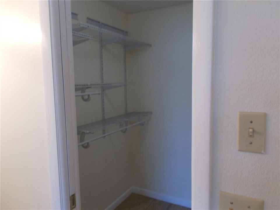 Left side view of the walk-in closet of the Master Bedroom.