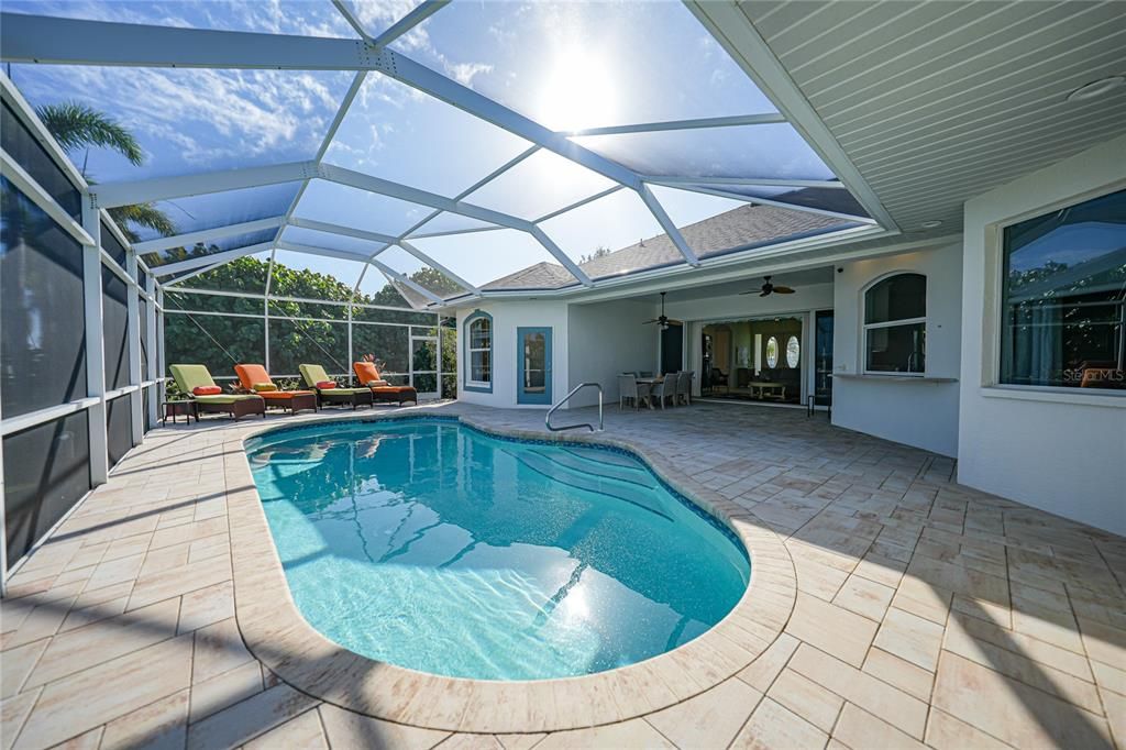 lots of pool deck, under roof lanai area and all the doors and windows bring so much fresh air and light