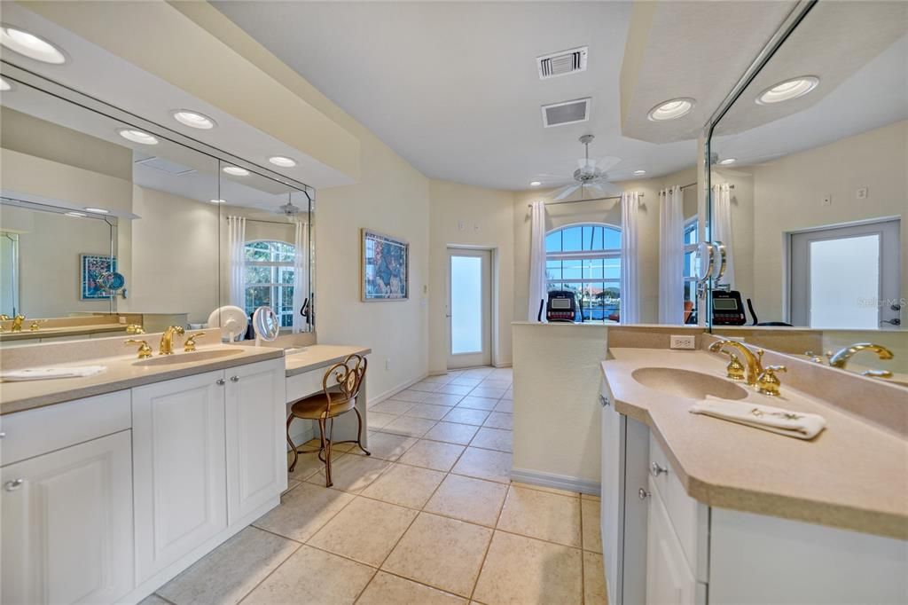 Primary bathroom -door leads to lanai-pool area