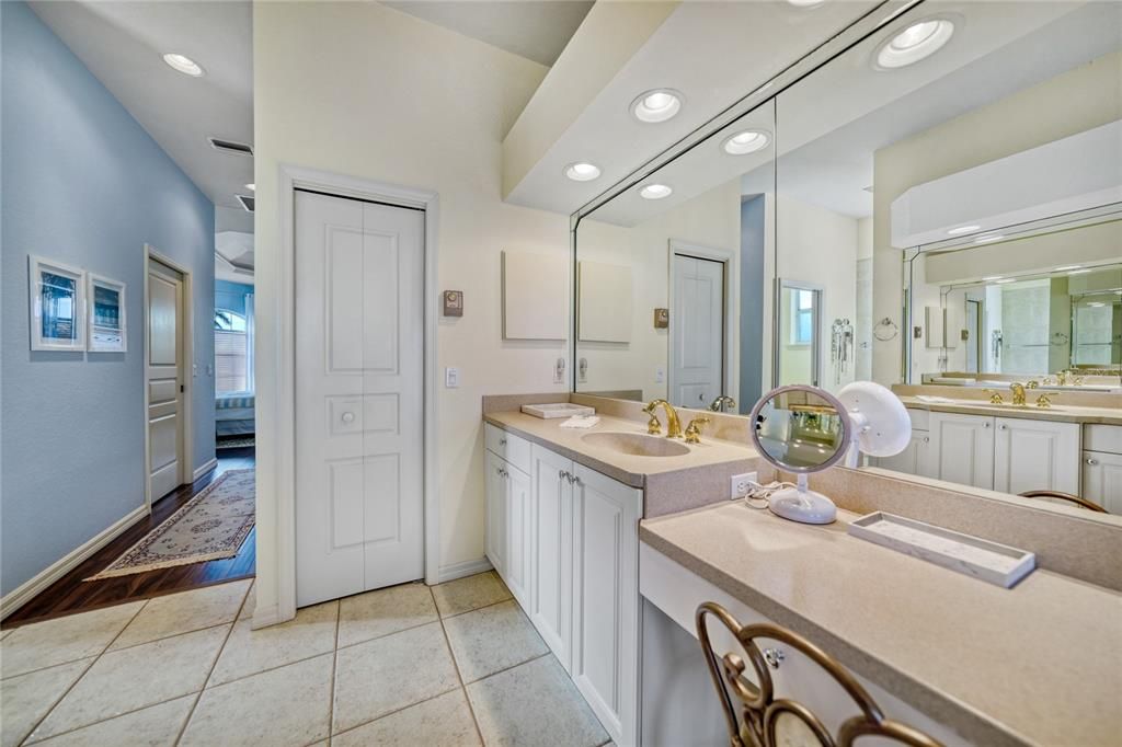 dual vanities and a make-up area, linen closet too.