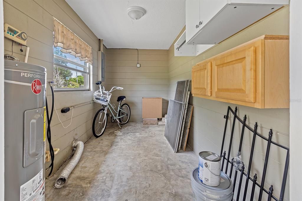 large storage shed and laundry off the carport