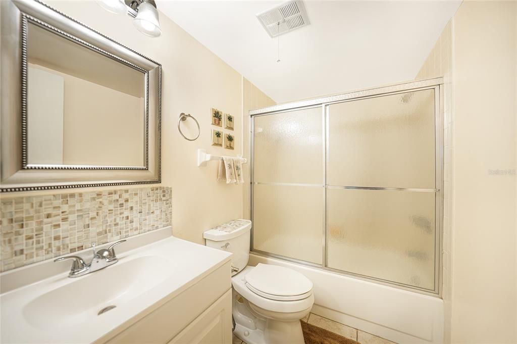 Bathroom with updated vanity, across the hall from the 2nd bedroom