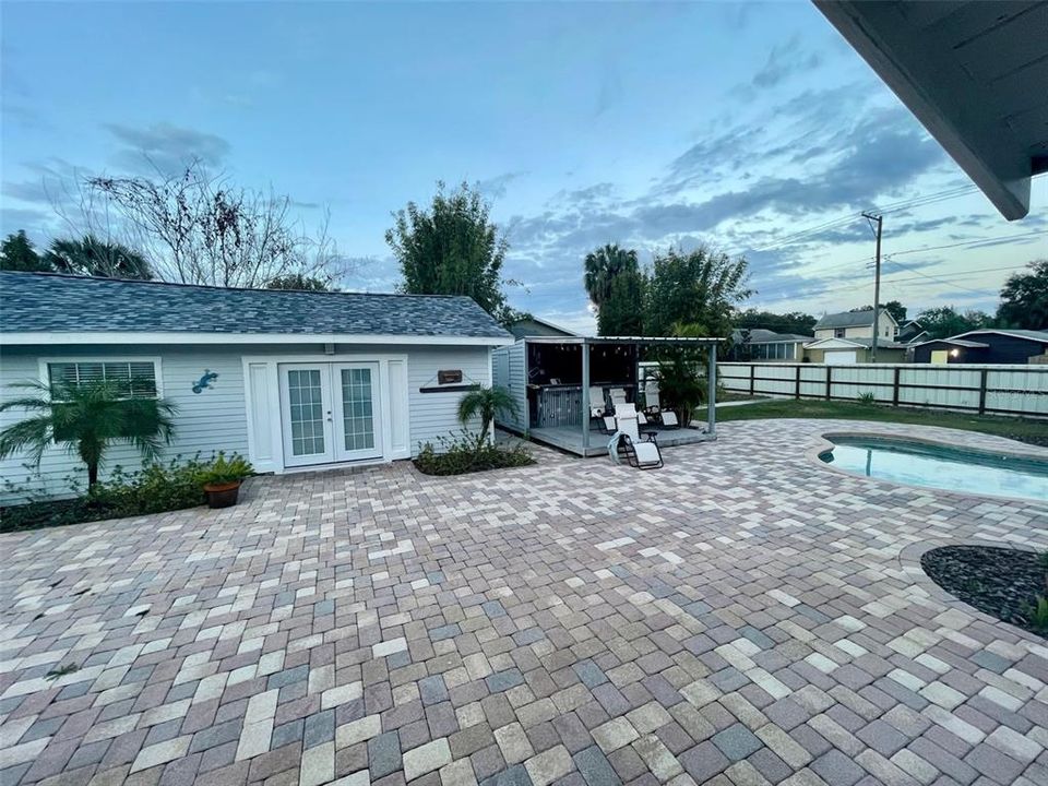 Guest House with view of patio, gazebo, pool and yard.