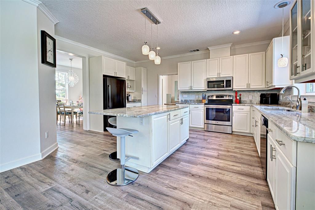 VIEW INTO KITCHEN AND DINING ROOM. WOW FACTOR!