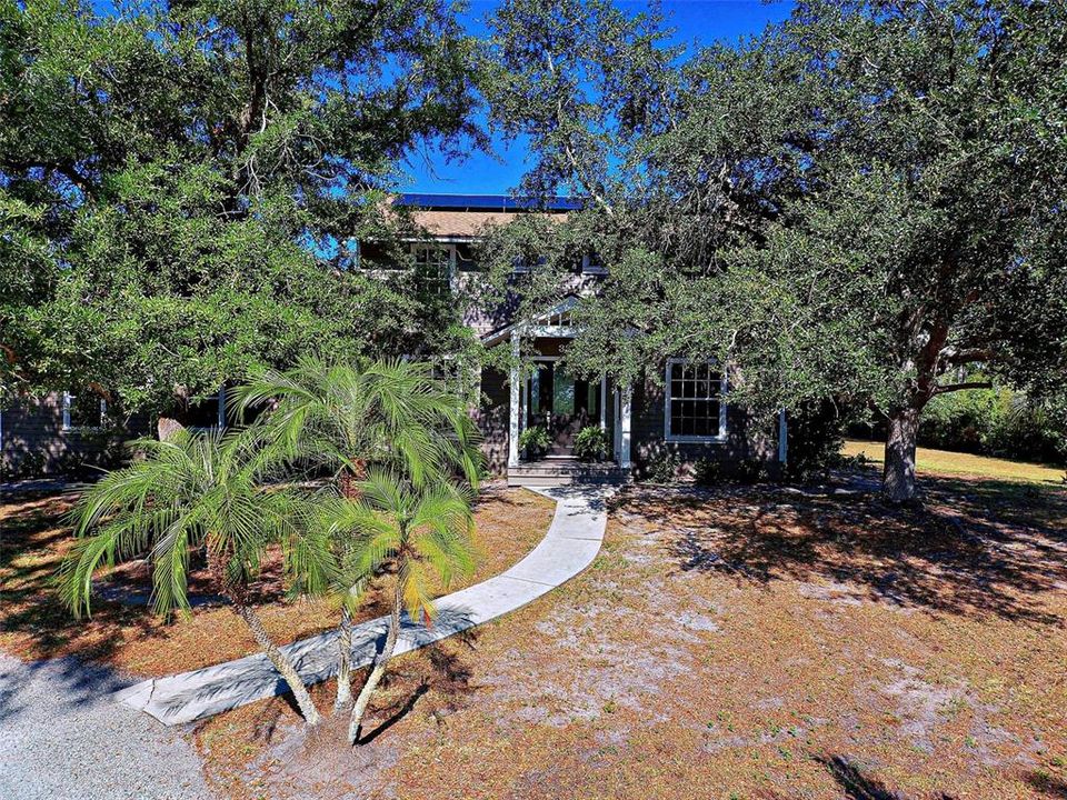 MATURE LANDSCAPE AND FRONT ENTRY.