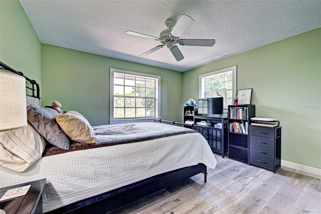 SECOND BEDROOM WITH TREE TOP VIEWS.