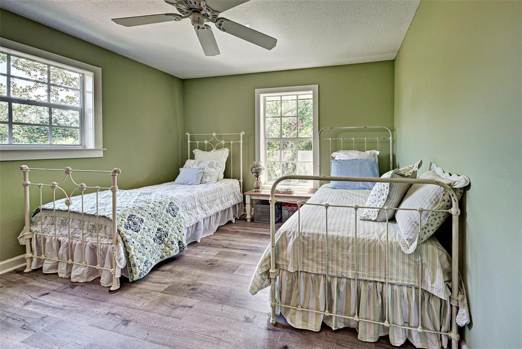 THIRD BEDROOM WITH TREE TOP VIEWS.