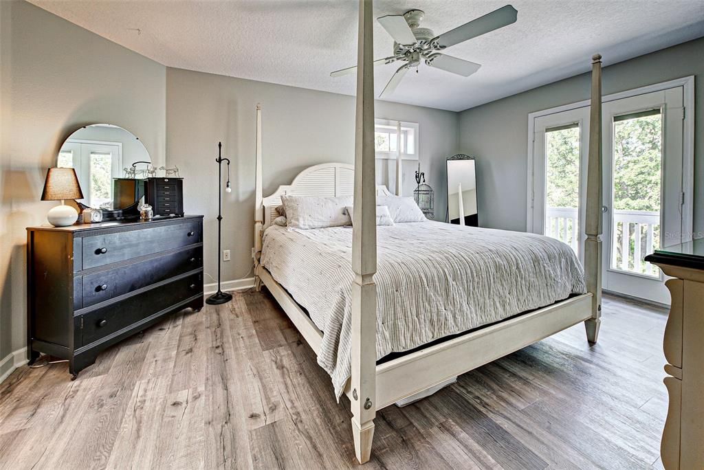 PRIMARY BEDROOM WITH FRENCH DOORS IN PLACE - A GREAT IDEA WOULD BE TO PUT A PRIVATE BALCONY OFF YOUR SUITE.