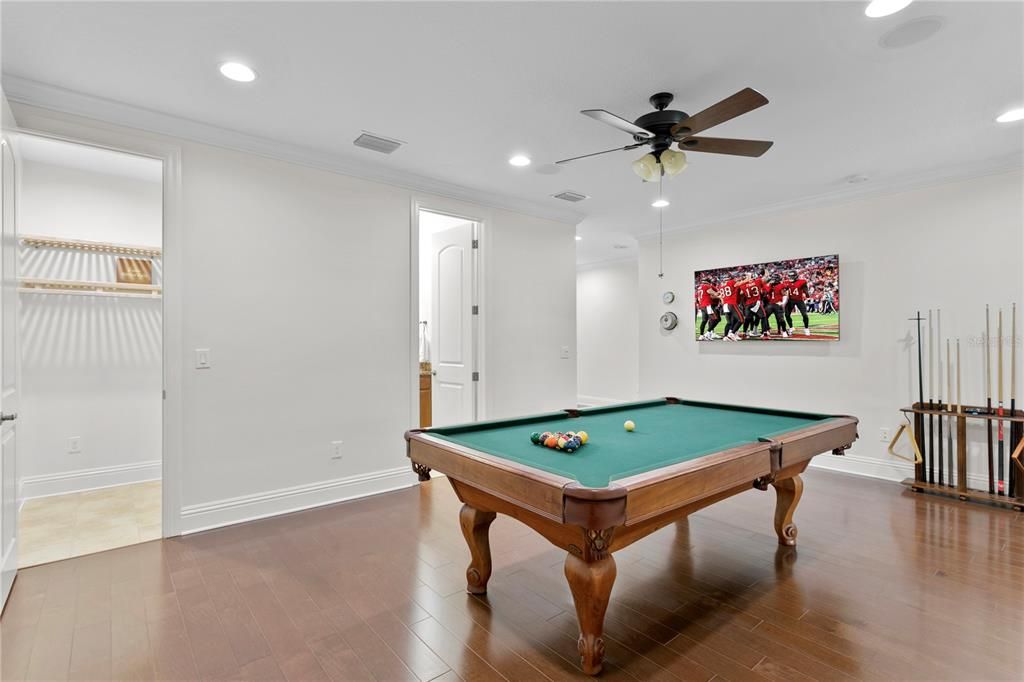 Upstairs game room with pool table that conveys