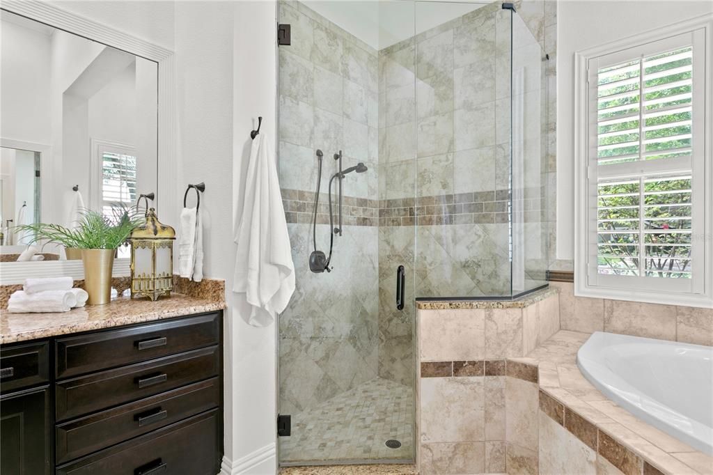 Primary suite bathroom with separate shower