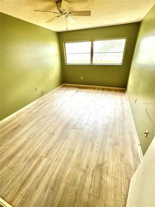 Bedroom has the updated plank flooring as the rest of the unit.