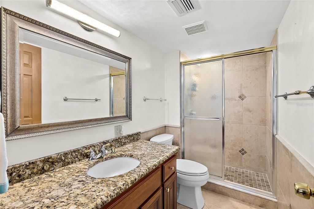 Full bath with granite counters