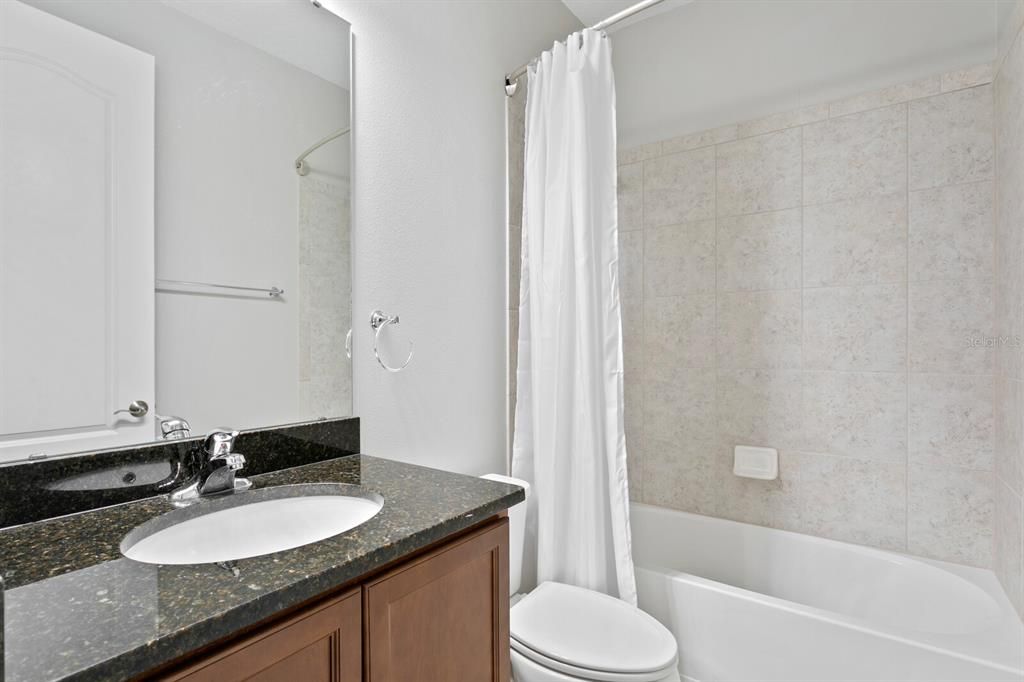 The 2nd full bath features granite counters and a tub/shower combo
