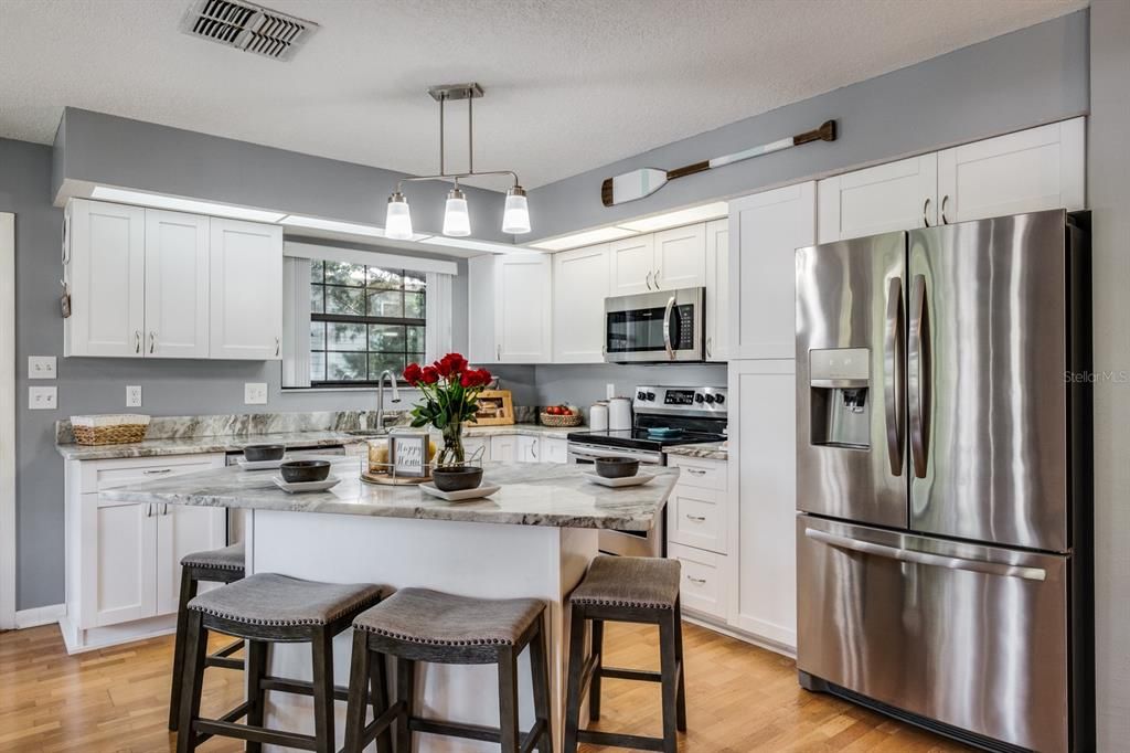 kitchen with granite counter tops and island