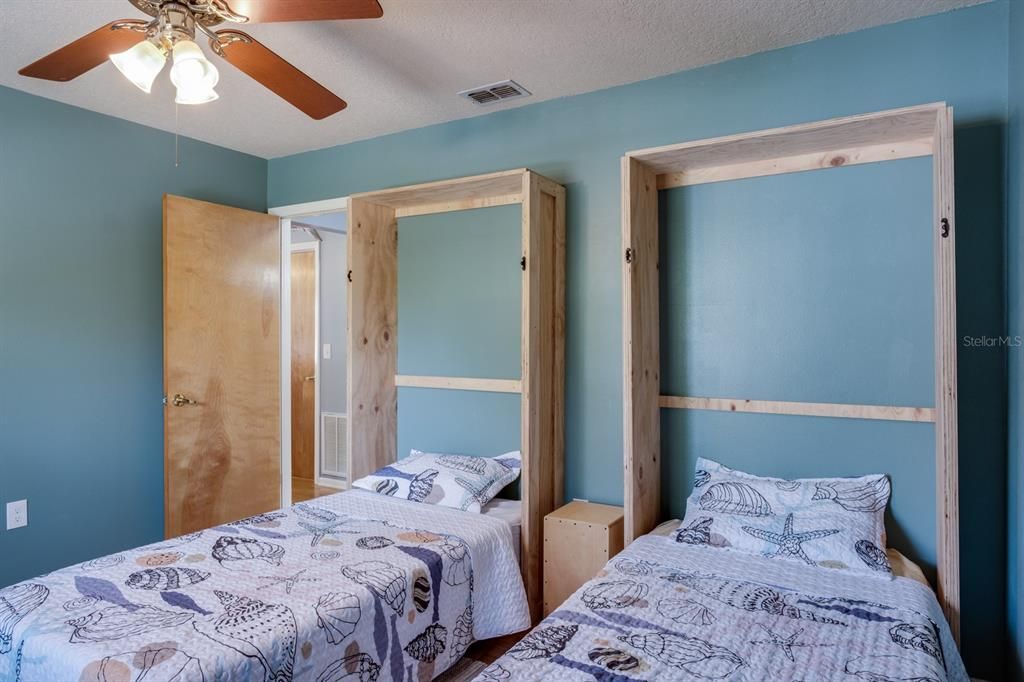 secondary bedroom with Murphy beds