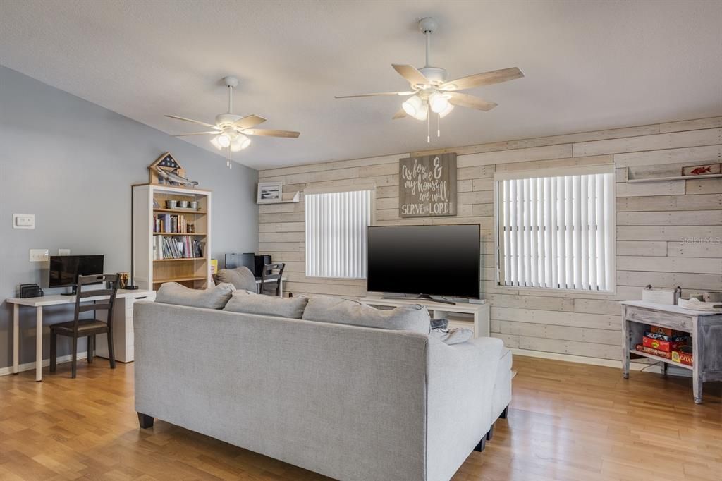 living room with custom wood wall