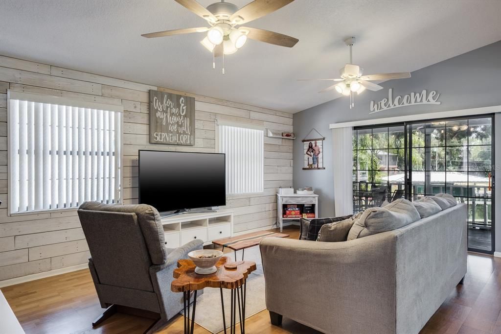 living room with sliding glass doors and view of the water