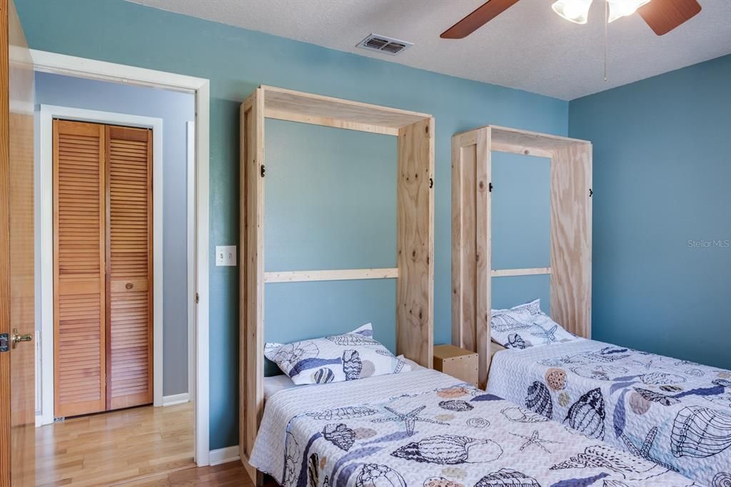 secondary bedroom with Murphy beds