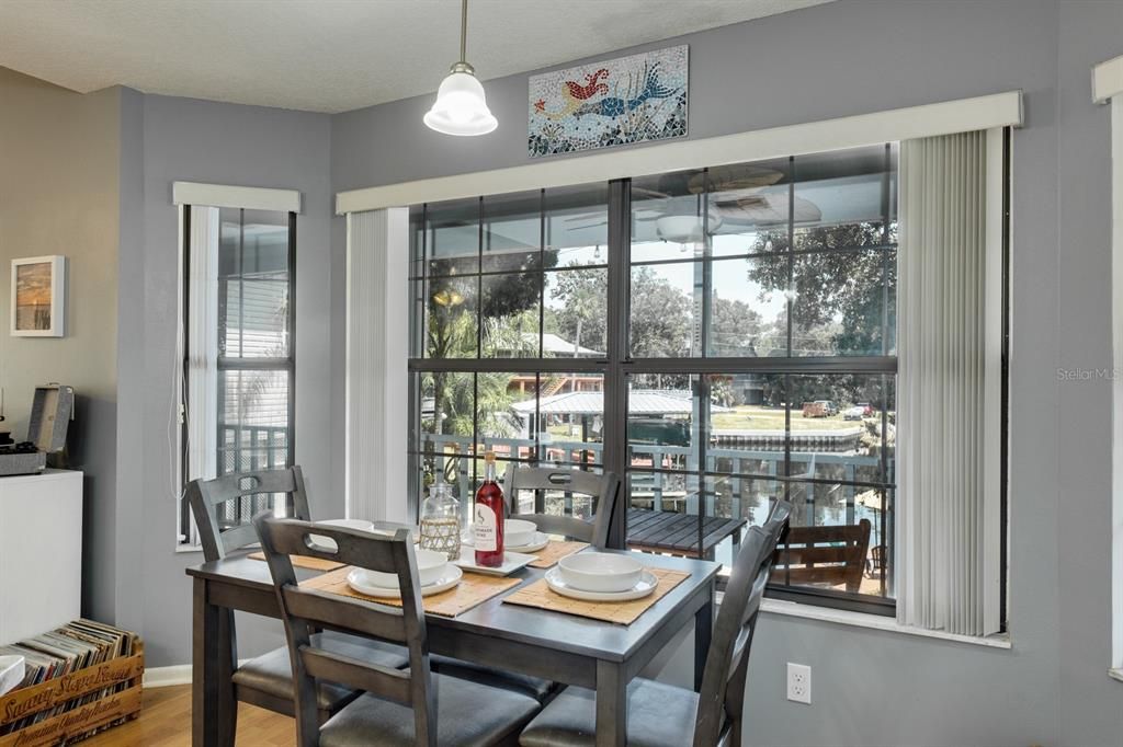 eating nook/dining space with bay windows and water view