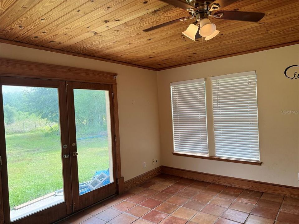 Master bedroom french doors that lead to back yard