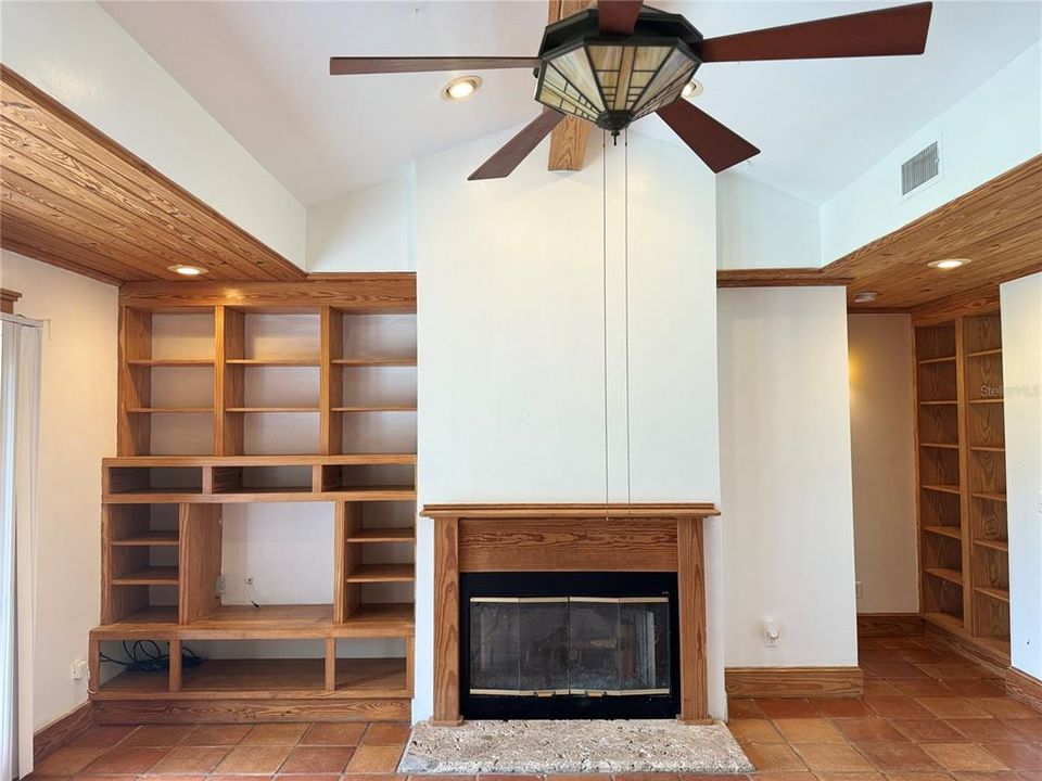 Living room, fireplace and built in shelving