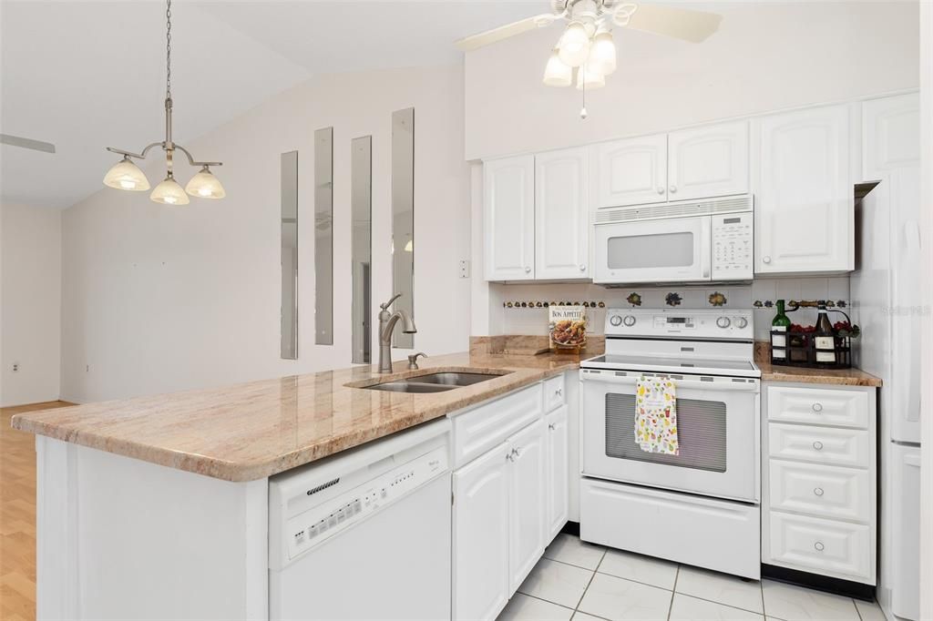 Kitchen has everything that you need including beautiful stone counters