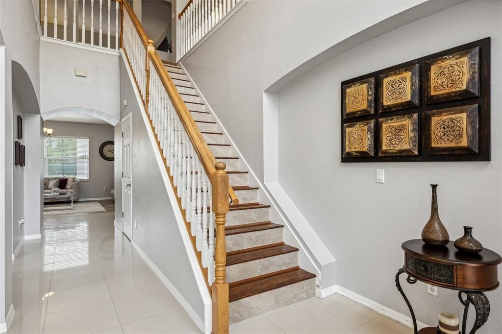 Take note of the lovely architectural details as you step through the front door and into a bright foyer, there is a formal living space to your left and you can follow the flow into the family room, dining room and eat-in kitchen.