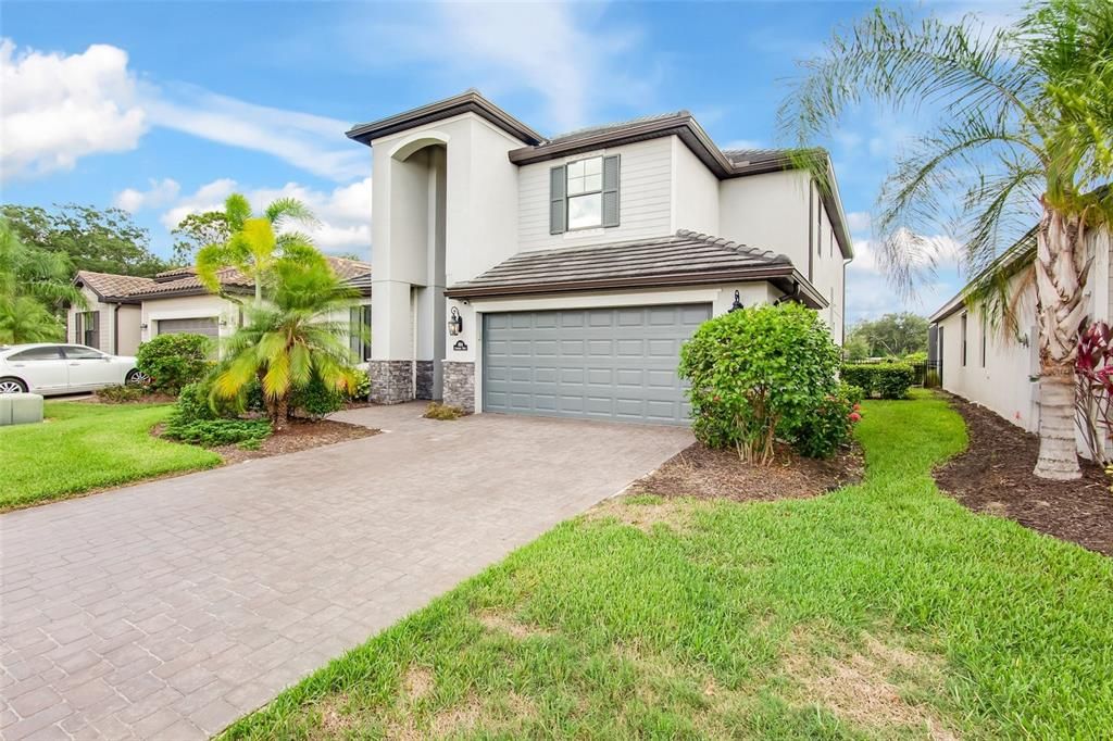 Popular Monte Carlo model on spacious lot with paver drive has nice curb appeal.