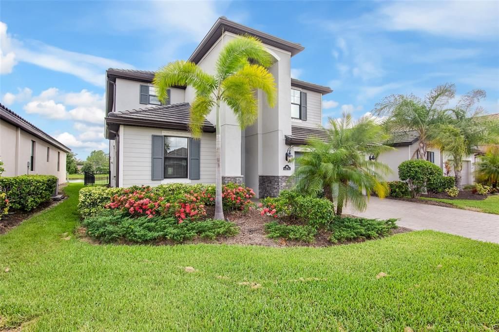 Popular Monte Carlo model on spacious lot with paver drive has nice curb appeal.