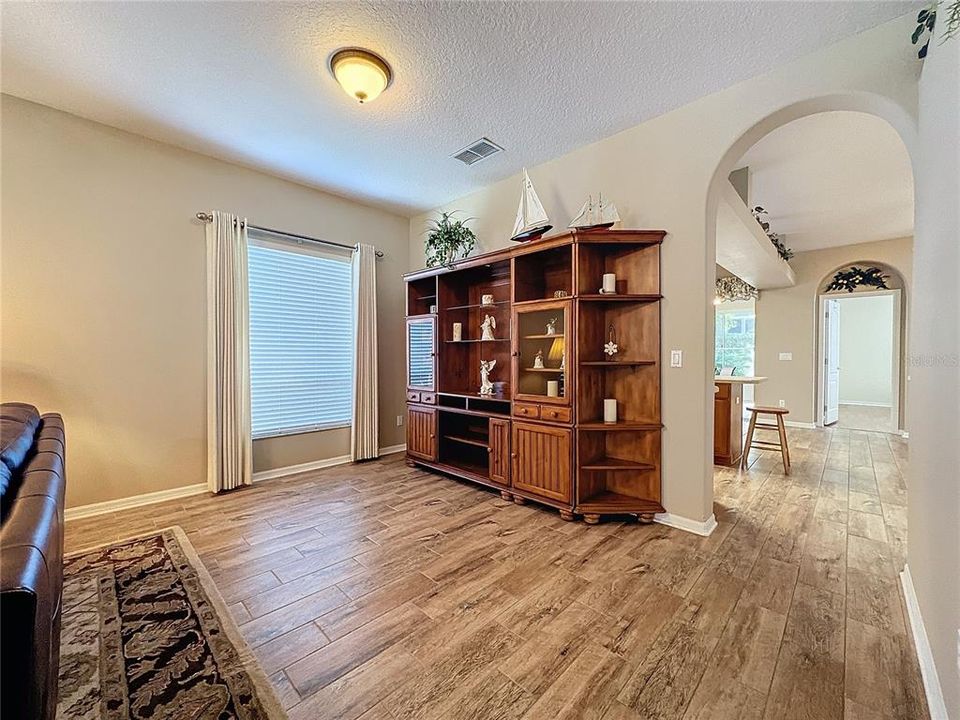 Great room to kitchen with wood look tile