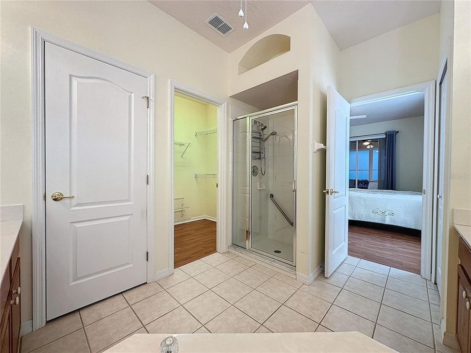 private toilet area, closet and walk in shower