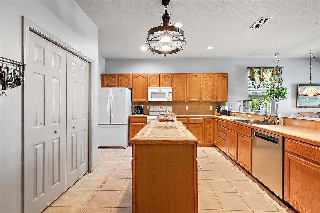 Center island, double closet pantry, loads of counter space and cabinetry