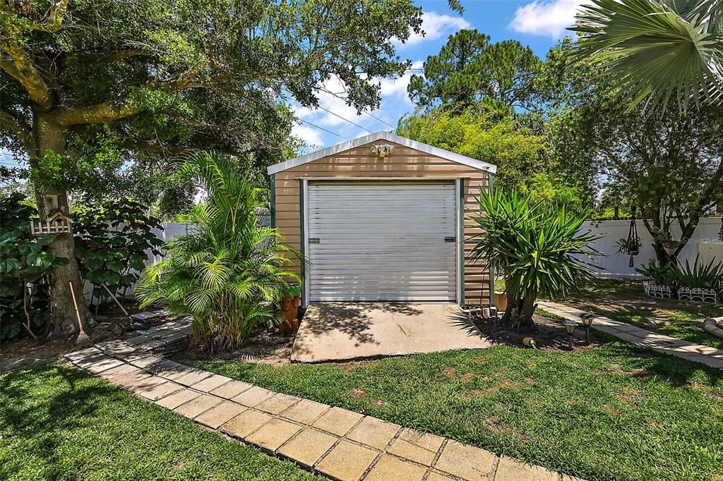 Shed is perfectly positioned in the back of the property to hold all your gardening equipment.