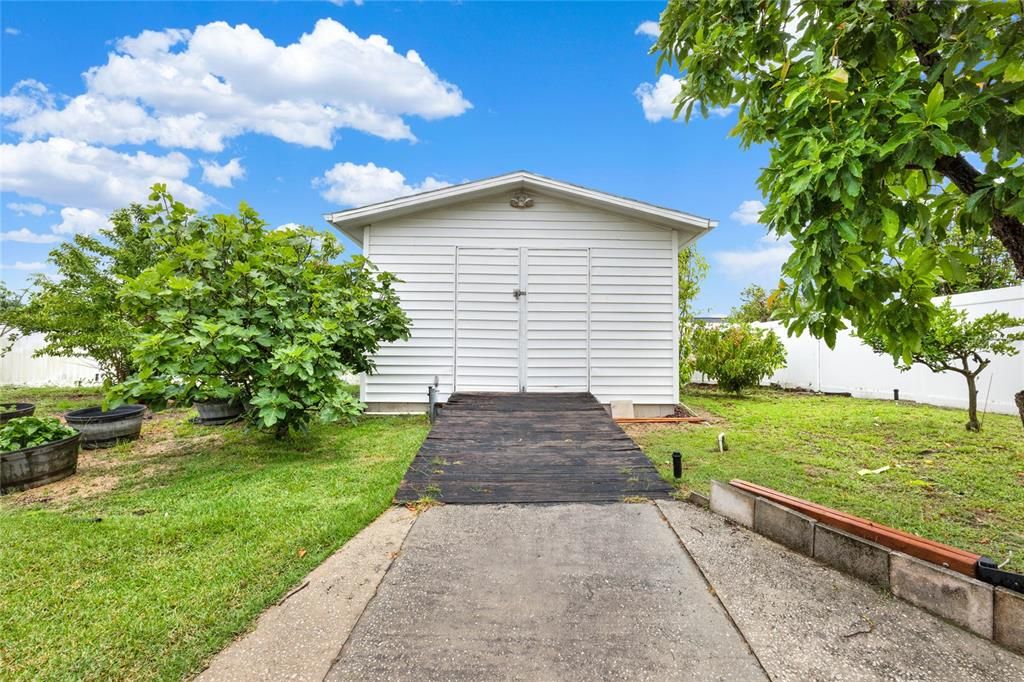 Outside of the enclosed Florida room there is additional covered patio space, shed for extra storage and the .24 ACRE LOT gives you ample backyard space all FENCED for added privacy.