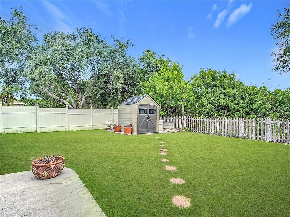 Backyard with additional shed.